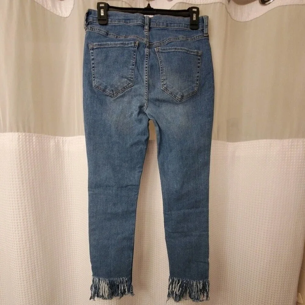 Free People light wash distressed diagonal raw‎ hem jeans size 30 new!!!